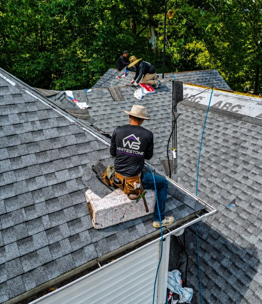 Whitestone crew working on a shingle roof